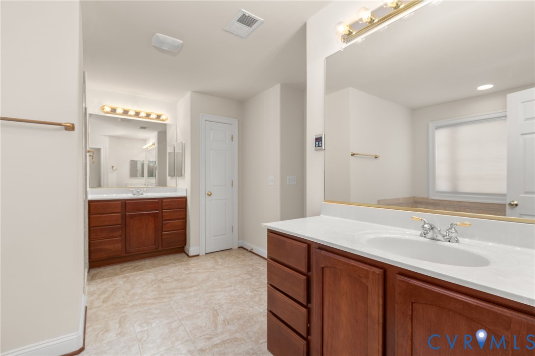 175 Shellfield Lane Colonial Beach, VA 22443 - Photo 53 of 100 Bathroom with two vanities and baseboards