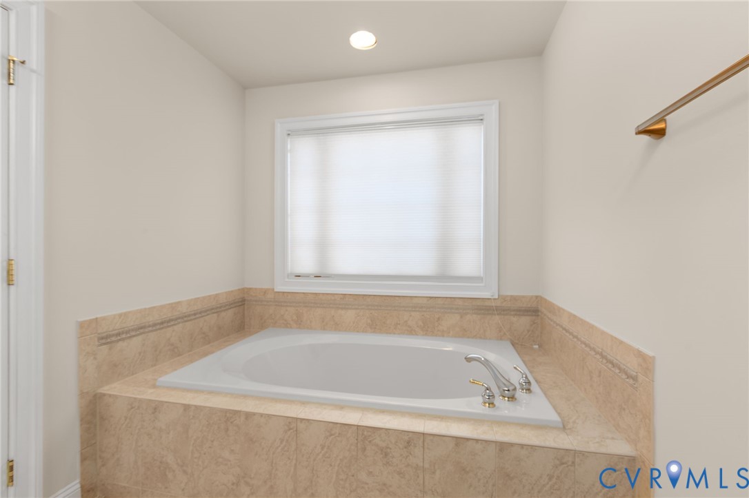 175 Shellfield Lane Colonial Beach, VA 22443 - Photo 55 of 100 a bath tub sitting in a bathroom next to a window