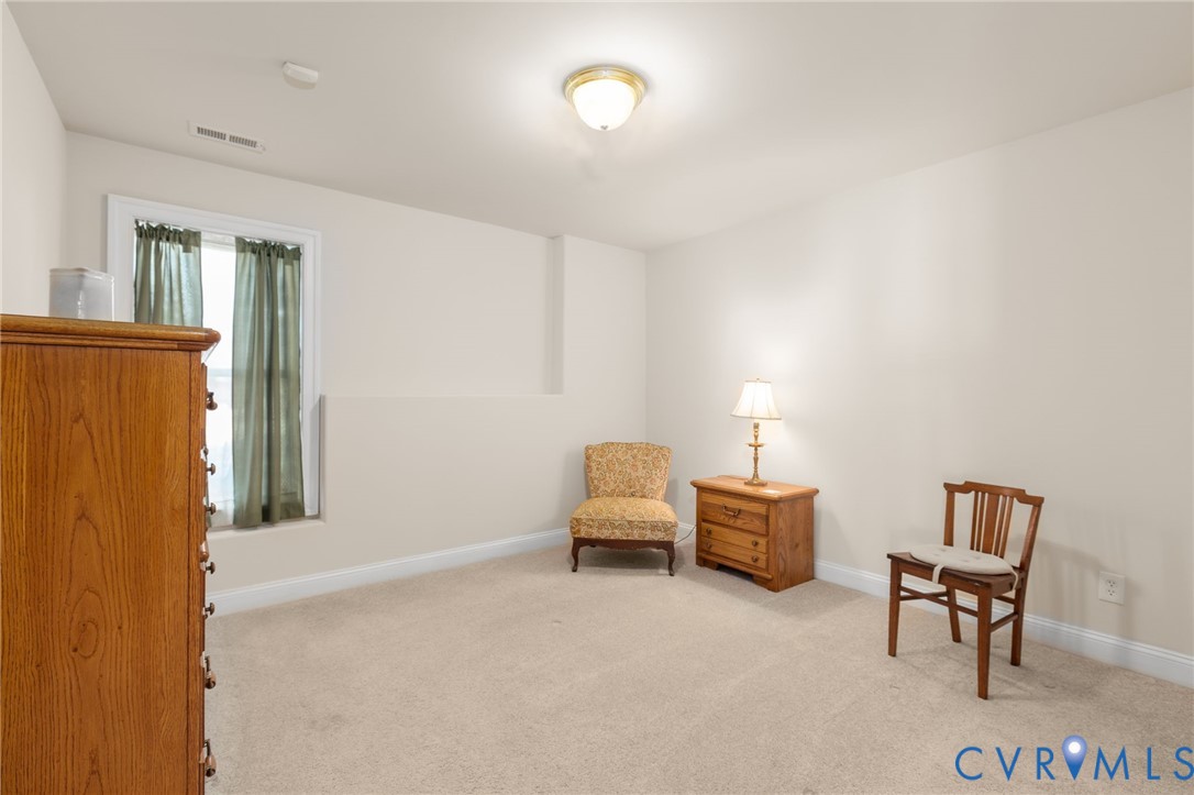175 Shellfield Lane Colonial Beach, VA 22443 - Photo 65 of 100 a living room with furniture and a window