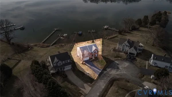 a view of a room with wooden floor and dining room