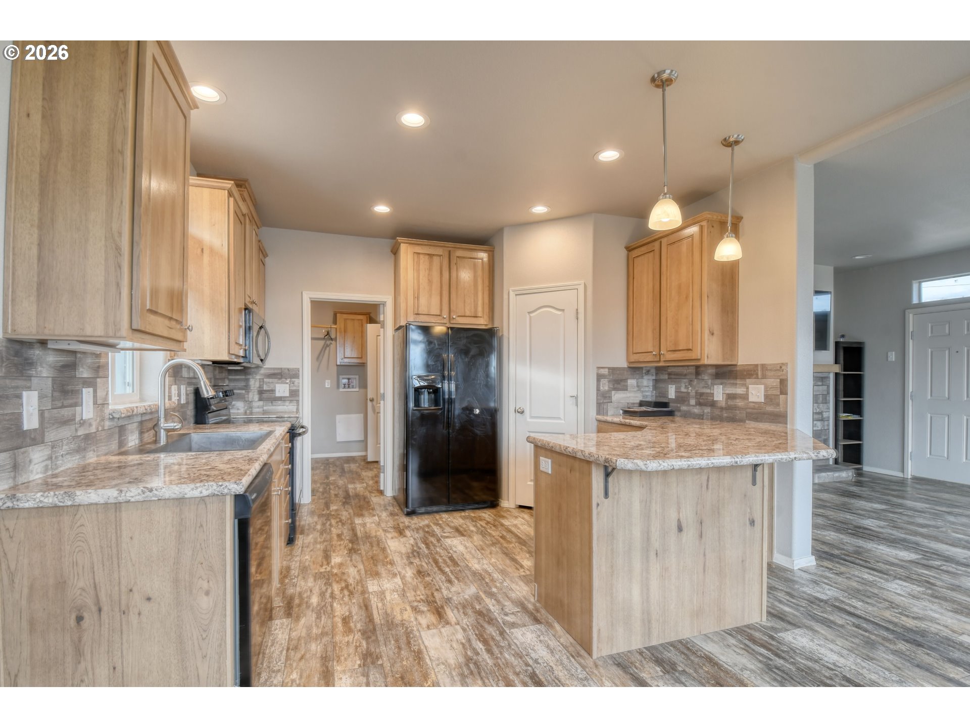 105 Columbia Street Helix, OR 97835 - Photo 12 of 34 a kitchen with refrigerator and cabinets