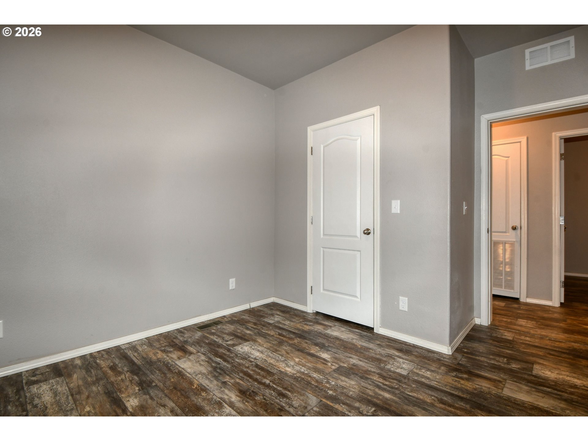 105 Columbia Street Helix, OR 97835 - Photo 23 of 34 a view of an empty room and wooden floor