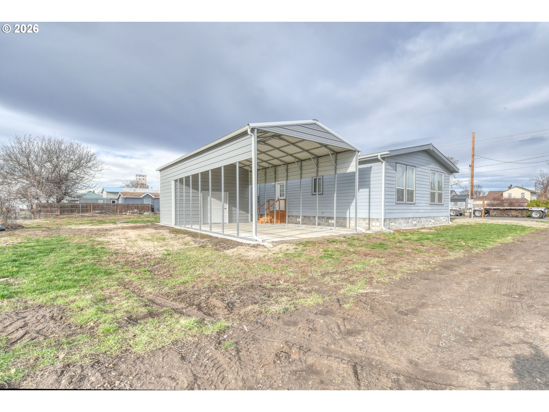 105 Columbia Street Helix, OR 97835 - Photo 3 of 34 a view of a house with a yard and sitting area
