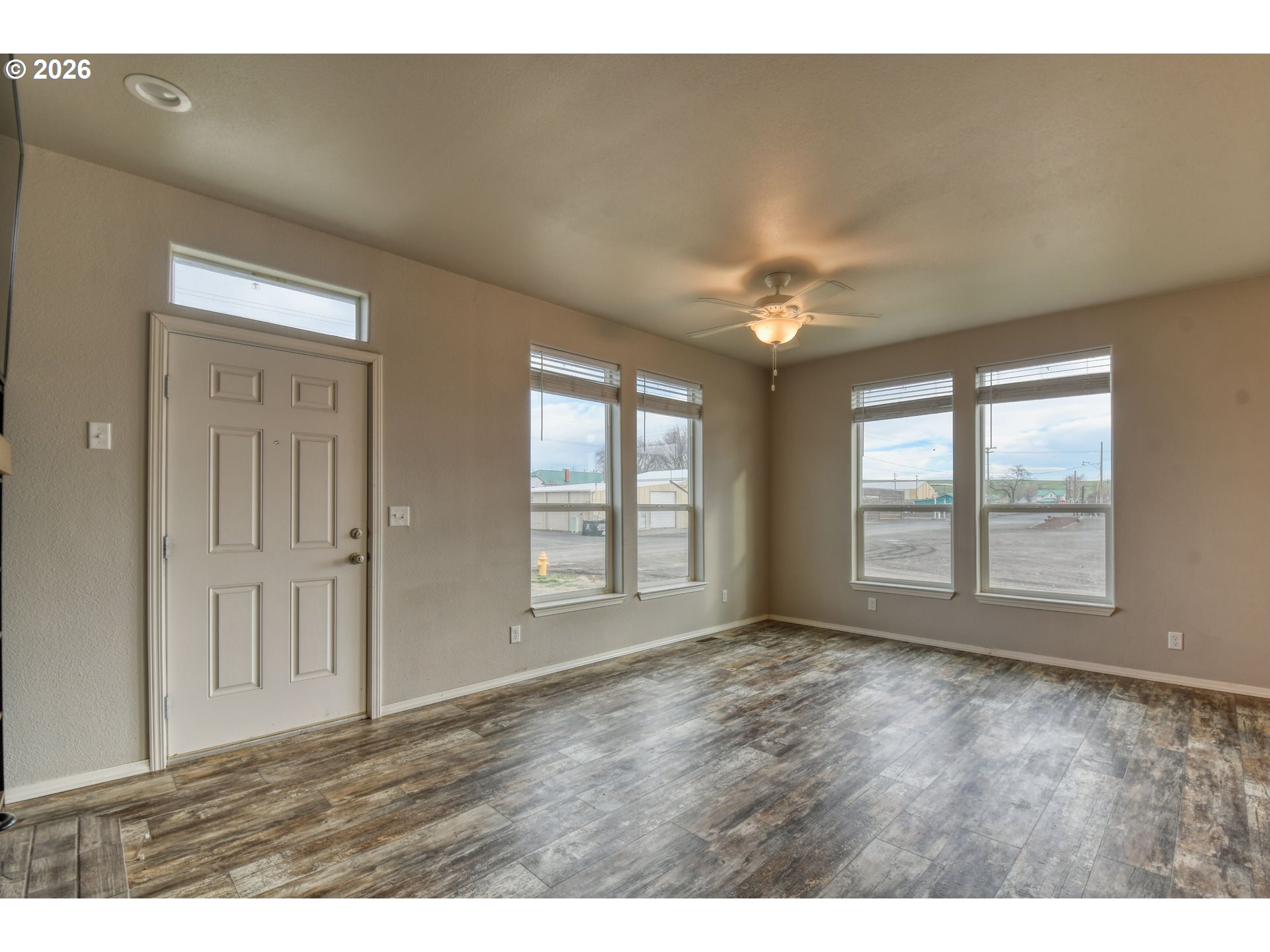 105 Columbia Street Helix, OR 97835 - Photo 4 of 34 a view of an empty room with a window