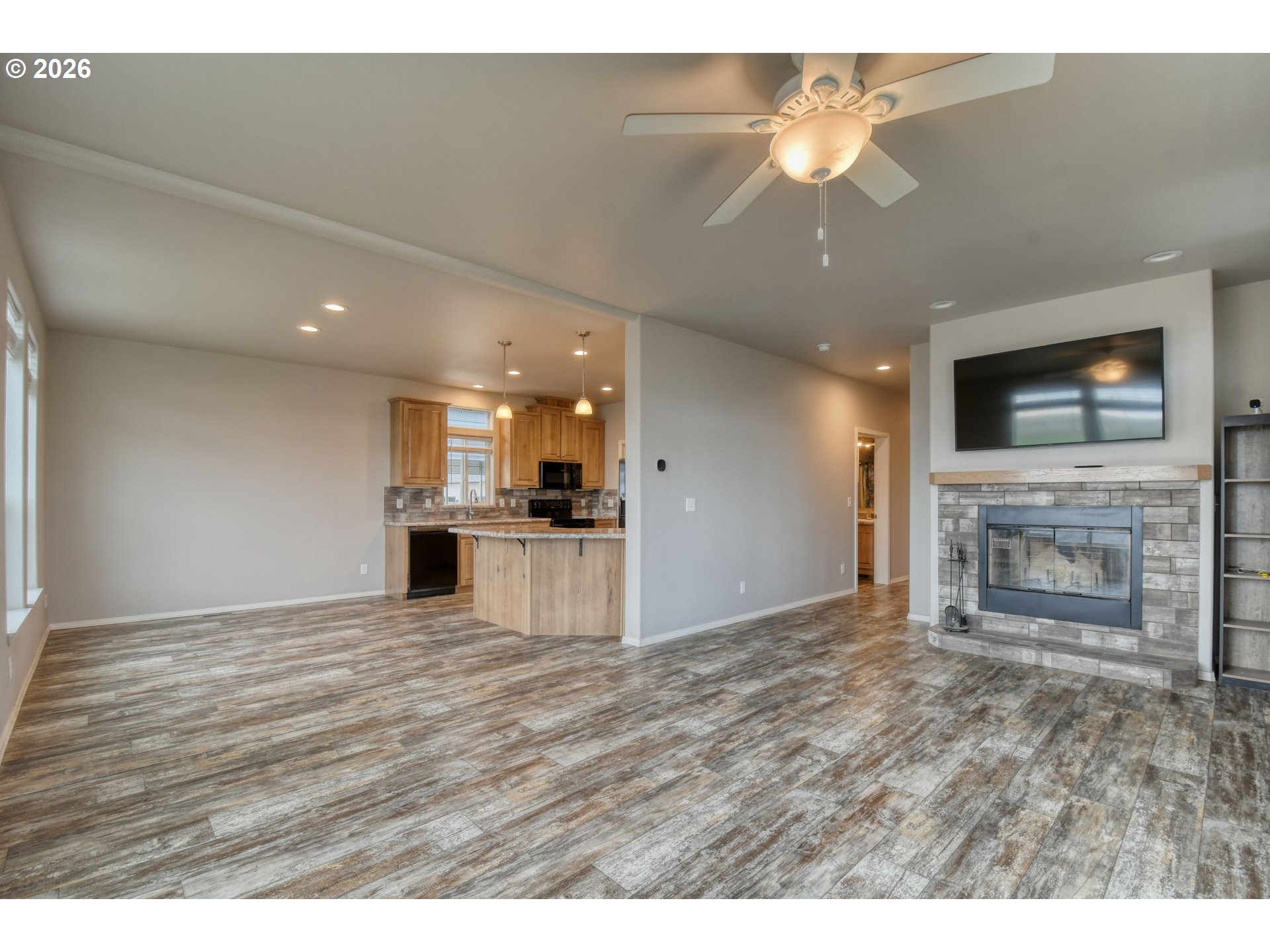 105 Columbia Street Helix, OR 97835 - Photo 7 of 34 a view of empty room with a fireplace and cabinet