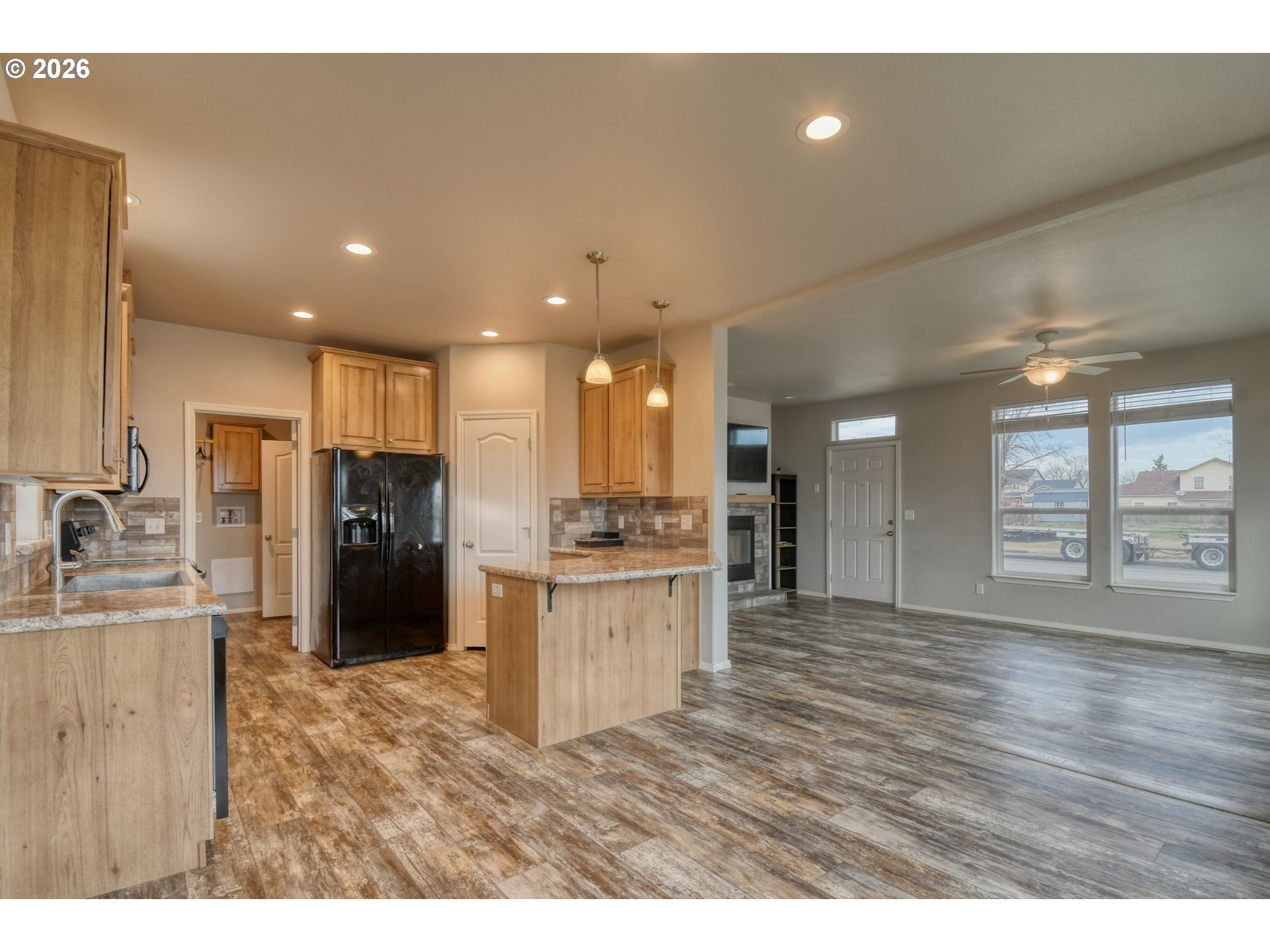 105 Columbia Street Helix, OR 97835 - Photo 9 of 34 a kitchen with refrigerator and cabinets