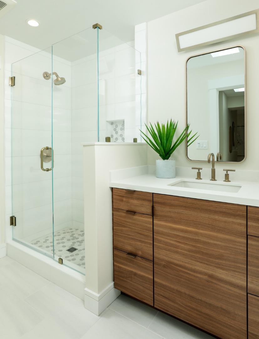 161 Stone Pine Lane Menlo Park, CA 94025 - Photo 19 of 26 a bathroom with a shower sink and mirror