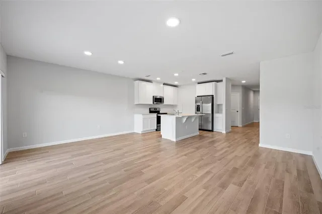 a view of kitchen with wooden floor