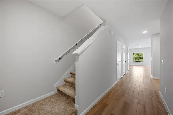 a view of entryway with wooden floor