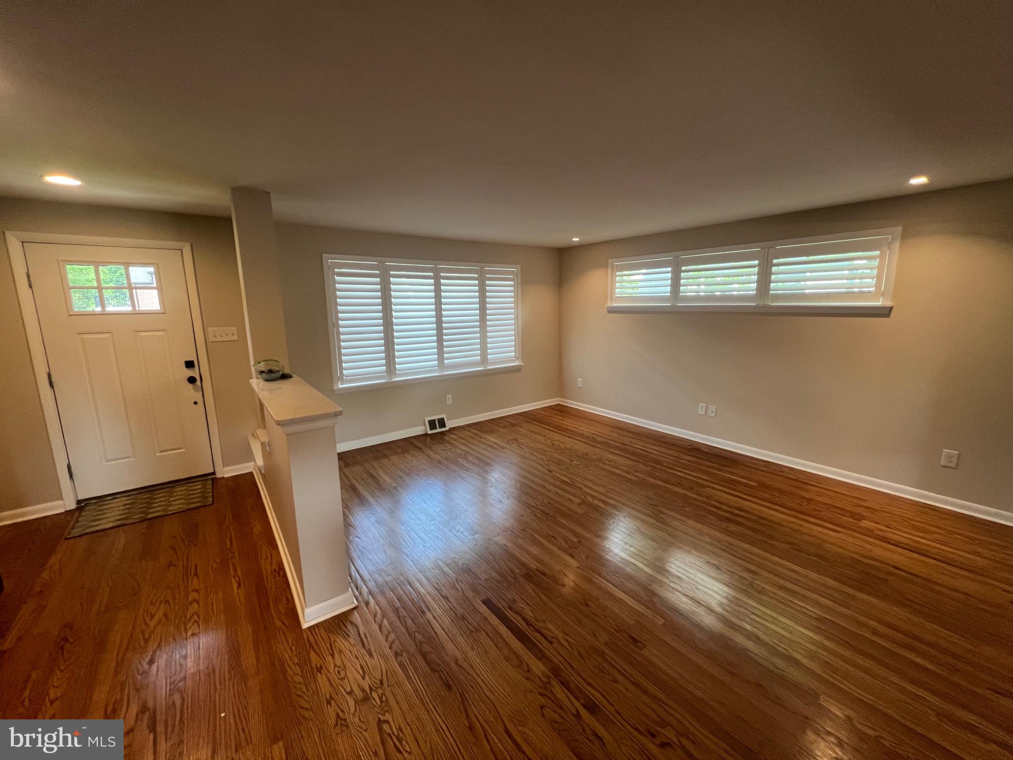 20 Fairview Road Swarthmore, PA 19081 - Photo 3 of 24 an empty room with wooden floor and windows