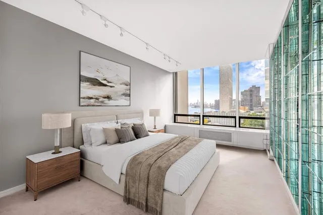 a view of a big room with windows and entryway of a house