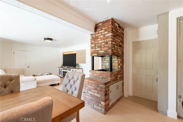 a bedroom with furniture and a flat screen tv