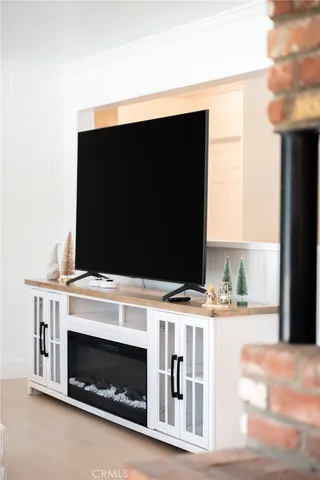 a kitchen with stainless steel appliances granite countertop a sink a stove and white cabinets