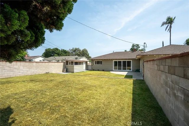 a view of a backyard with a patio