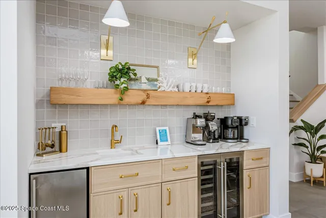 a view of a dining room with furniture and a flat screen tv