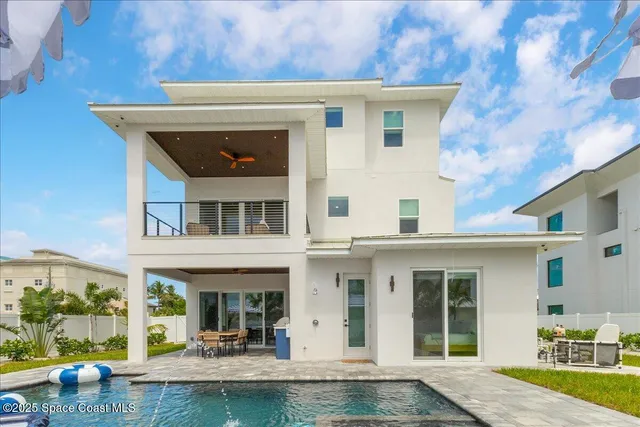 a kitchen with a sink refrigerator and microwave