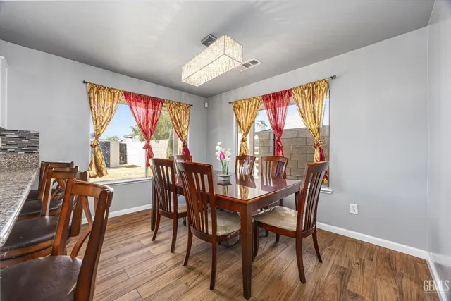 a dining room with furniture window wooden floor