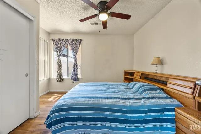 a bedroom with bed and window