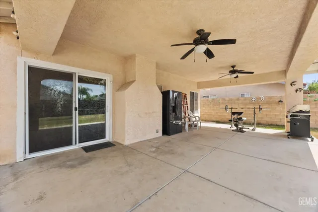a dining room with furniture and a floor to ceiling window
