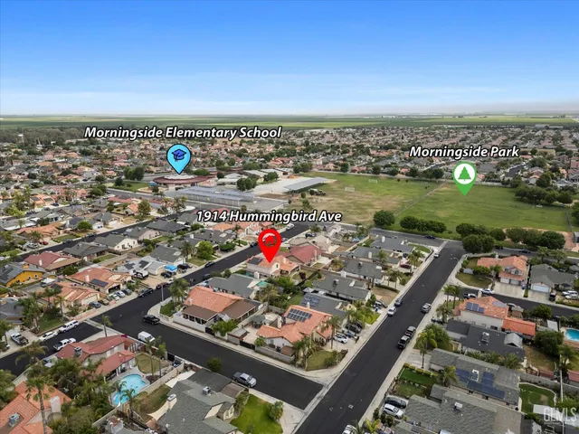 an aerial view of river residential houses with outdoor space and seating