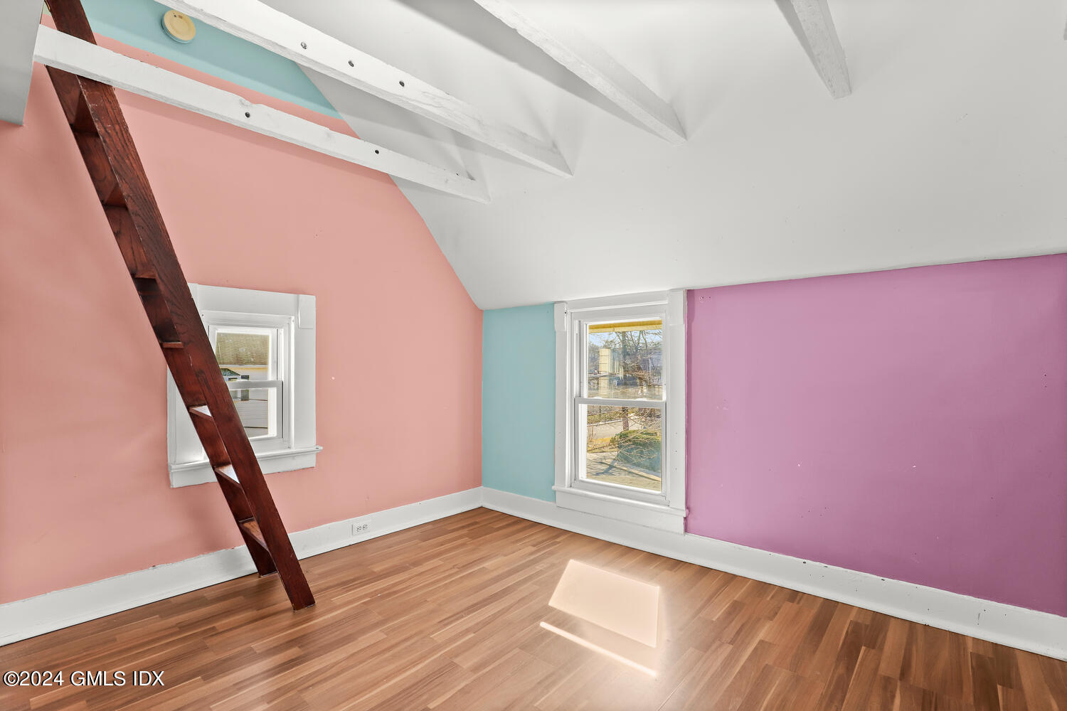 71 Old Field Point Road Greenwich, CT 06830 - Photo 16 of 23 a view of an empty room with wooden floor and stairs