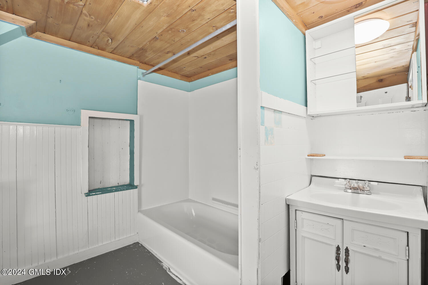 71 Old Field Point Road Greenwich, CT 06830 - Photo 17 of 23 a bathroom with a bathtub and shower