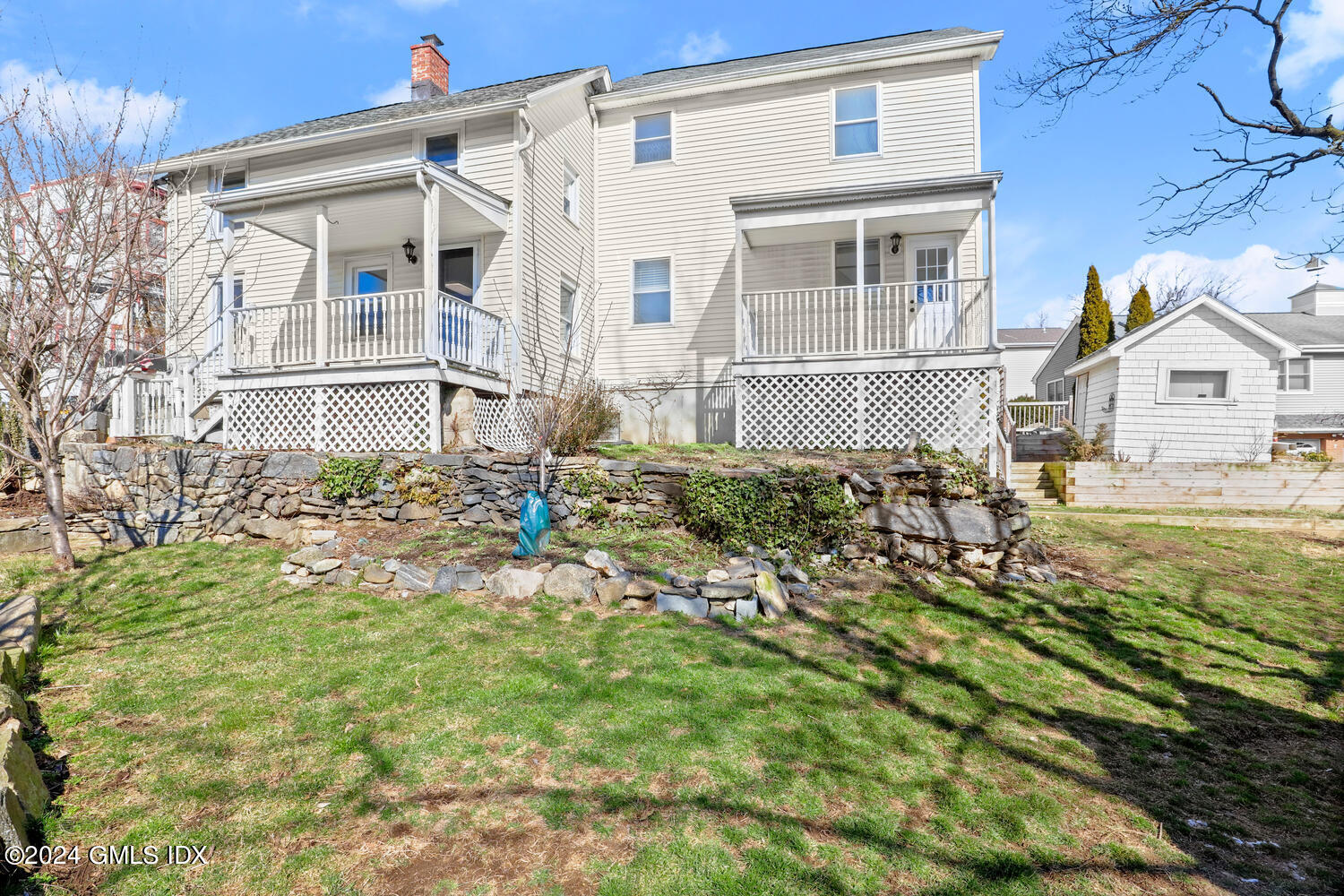 71 Old Field Point Road Greenwich, CT 06830 - Photo 2 of 23 front view of a house with a yard