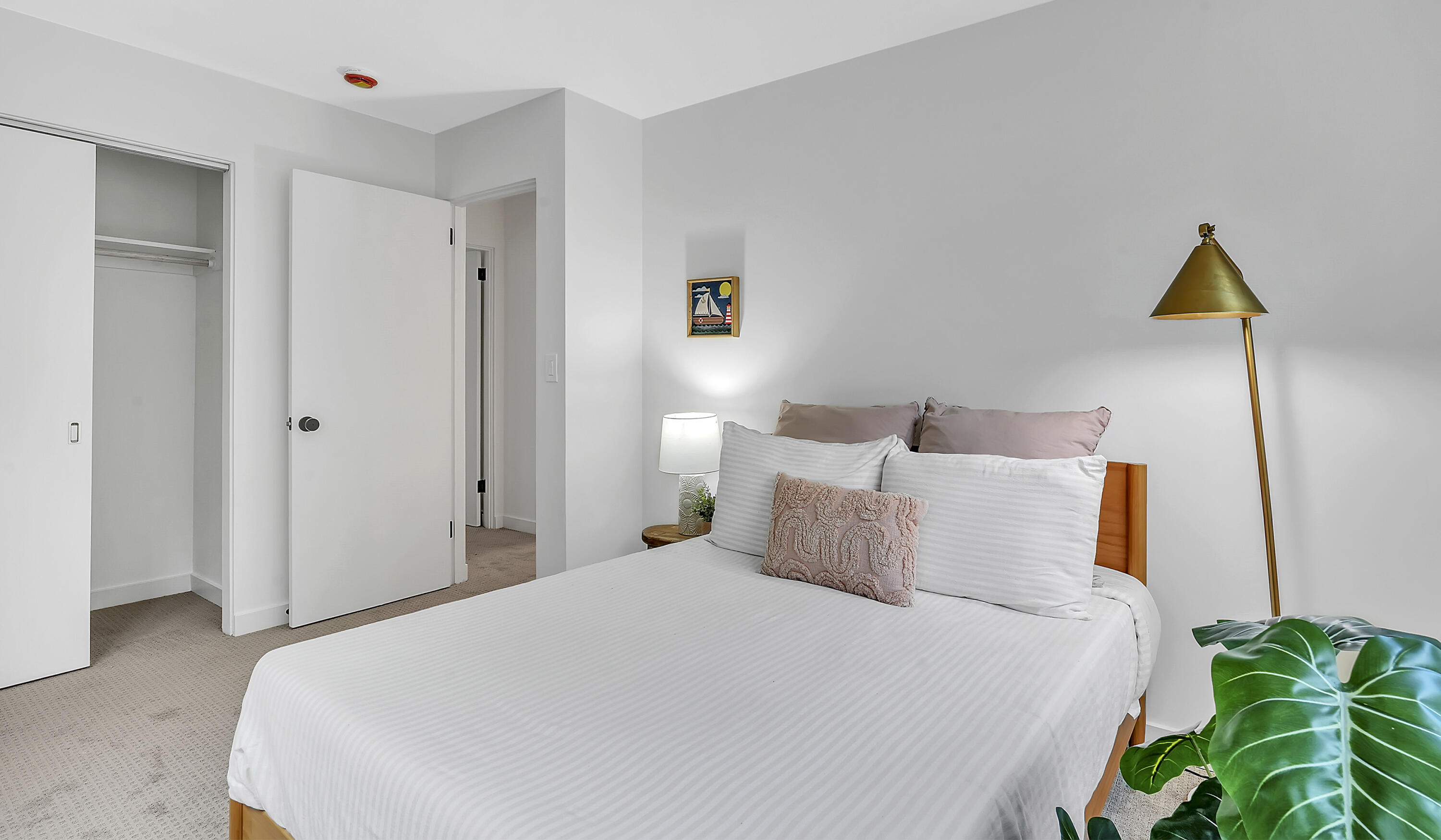 1708 Castillo Street Santa Barbara, CA 93101 - Photo 14 of 19 a bedroom with a bed and a potted plant