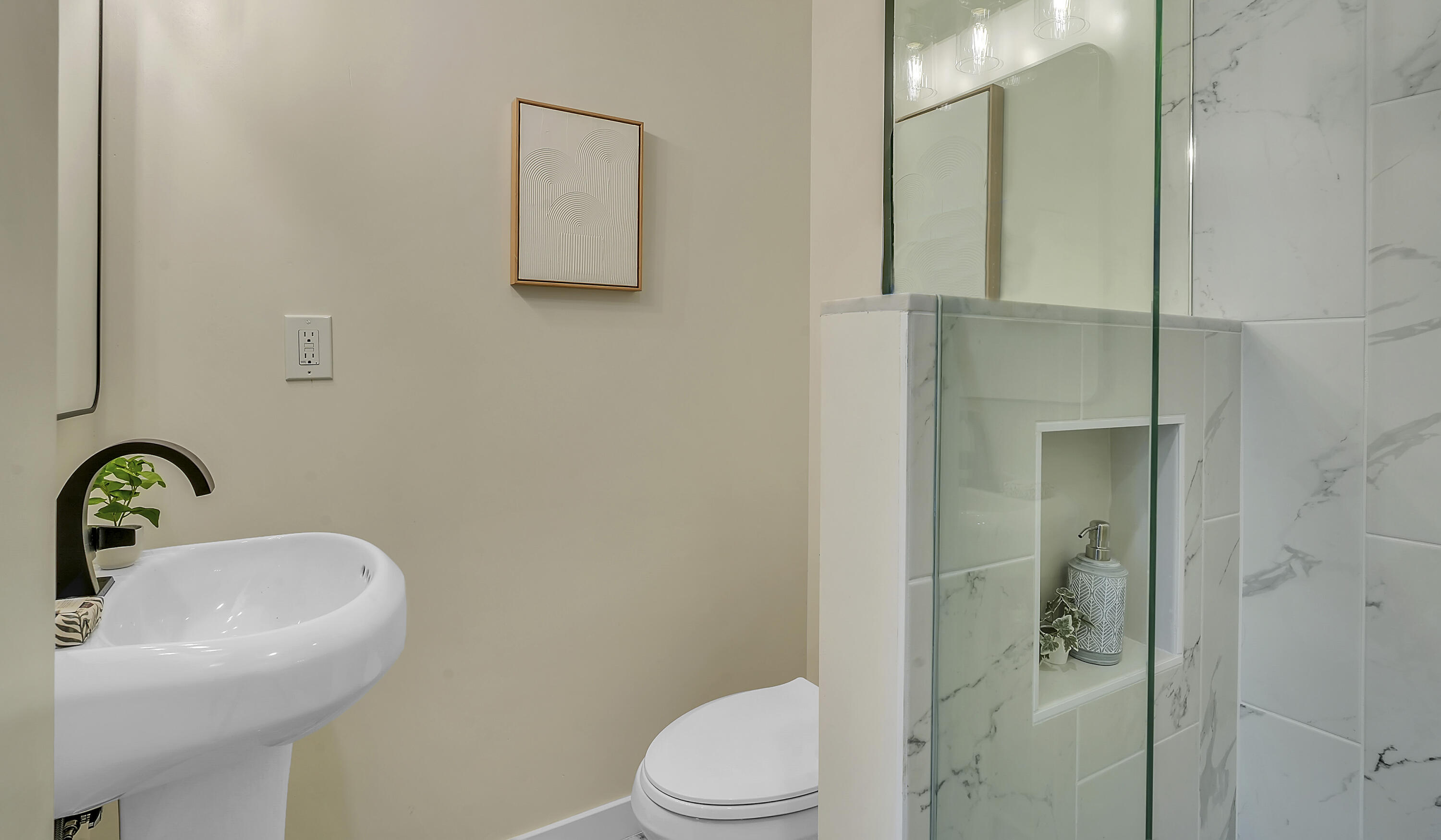 1708 Castillo Street Santa Barbara, CA 93101 - Photo 7 of 19 a bathroom with a sink a toilet and shower