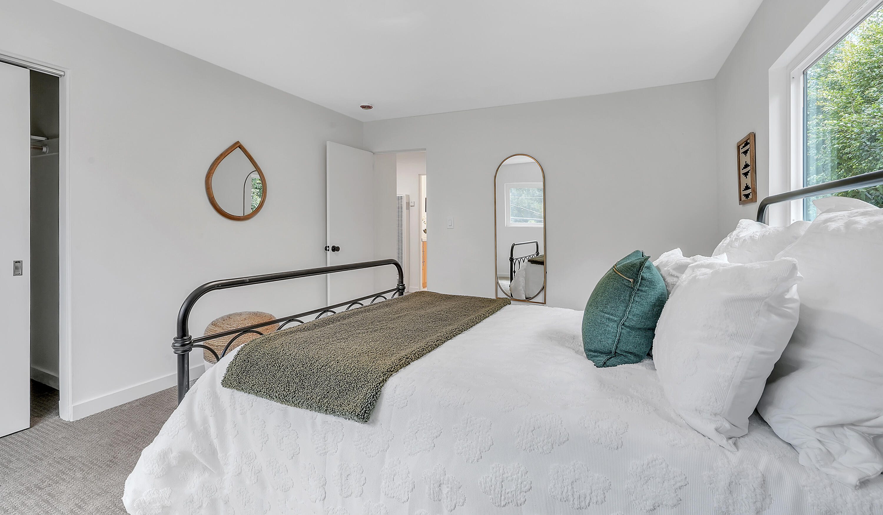 1708 Castillo Street Santa Barbara, CA 93101 - Photo 10 of 19 a bedroom with a bed mirror and window