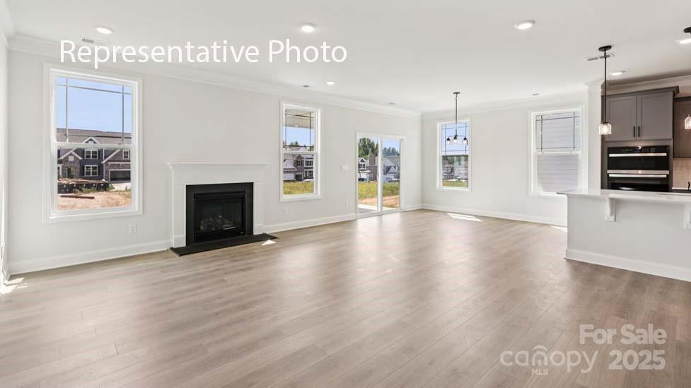 7633 Bainbridge Road Sherrills Ford, NC 28673 - Photo 15 of 34 a view of an empty room with window and fire place