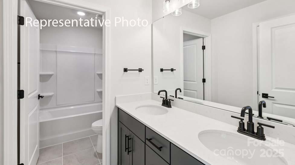 7633 Bainbridge Road Sherrills Ford, NC 28673 - Photo 23 of 34 a bathroom with a sink double vanity and a bathtub