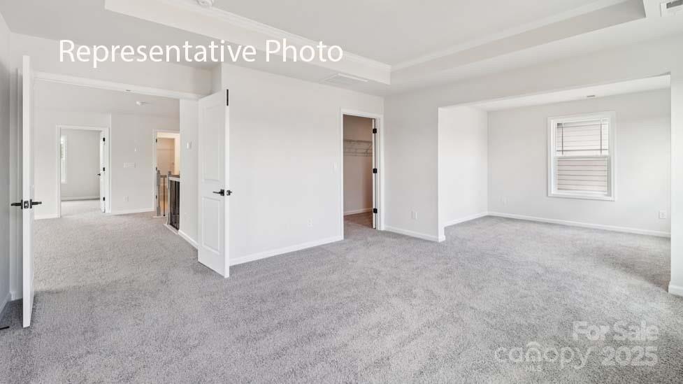 7633 Bainbridge Road Sherrills Ford, NC 28673 - Photo 26 of 34 an empty room with windows and closet