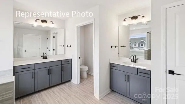 a bathroom with a tub shower and sink