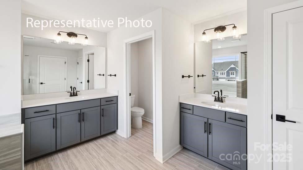 7633 Bainbridge Road Sherrills Ford, NC 28673 - Photo 27 of 34 a spacious bathroom with a double vanity sink mirror and