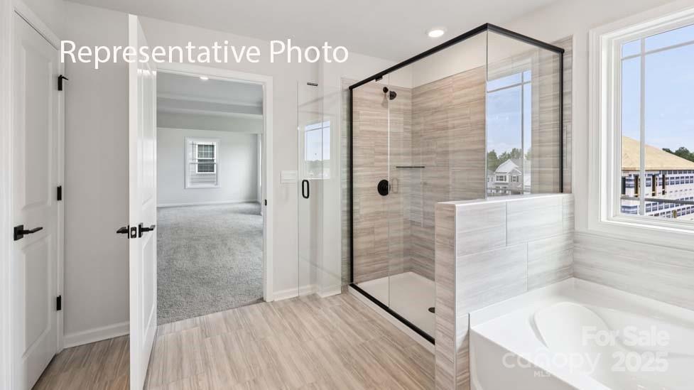 7633 Bainbridge Road Sherrills Ford, NC 28673 - Photo 29 of 34 a bathroom with a bathtub and a shower