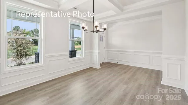 a view of a chandelier in an empty room