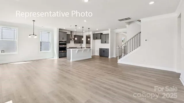 a view of a kitchen with wooden floor