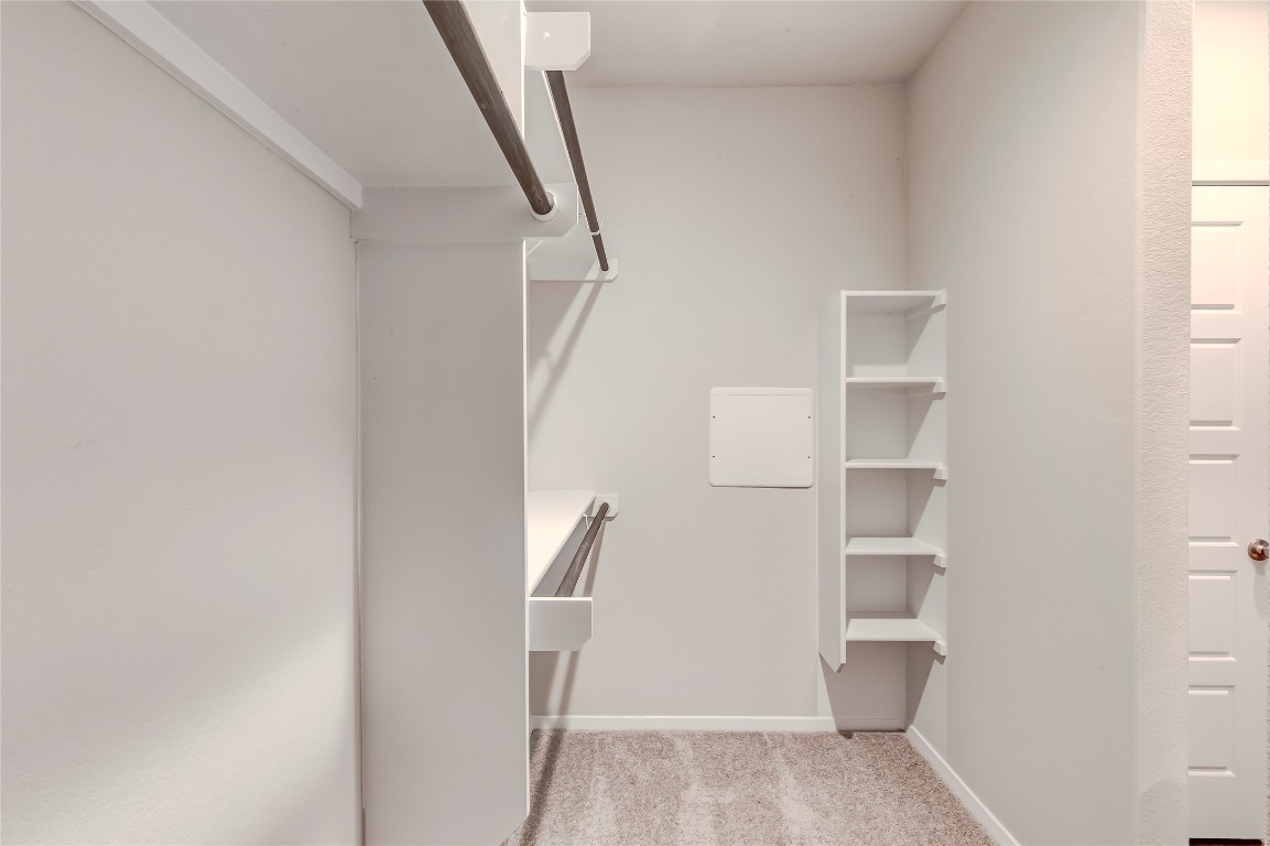 274 Jade Street Maxwell, TX 78656 - Photo 13 of 36 a view of walk in closet with empty racks