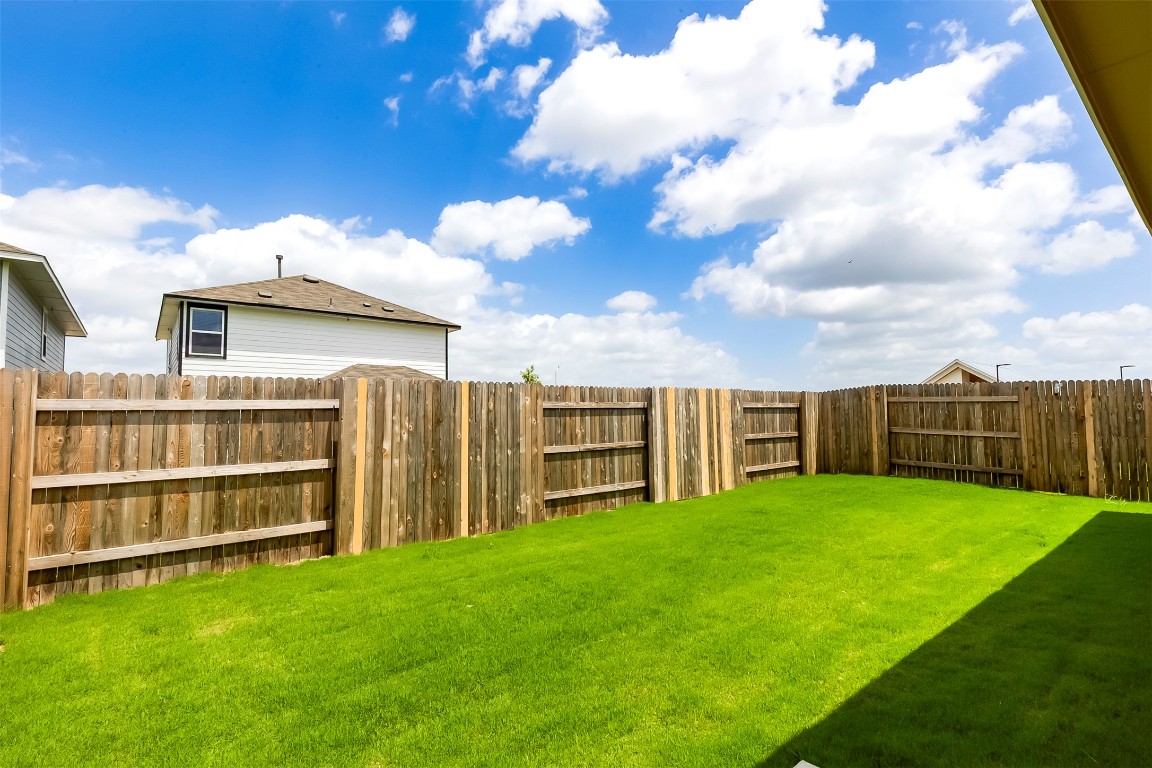 274 Jade Street Maxwell, TX 78656 - Photo 19 of 36 a view of a deck with a big yard and large trees