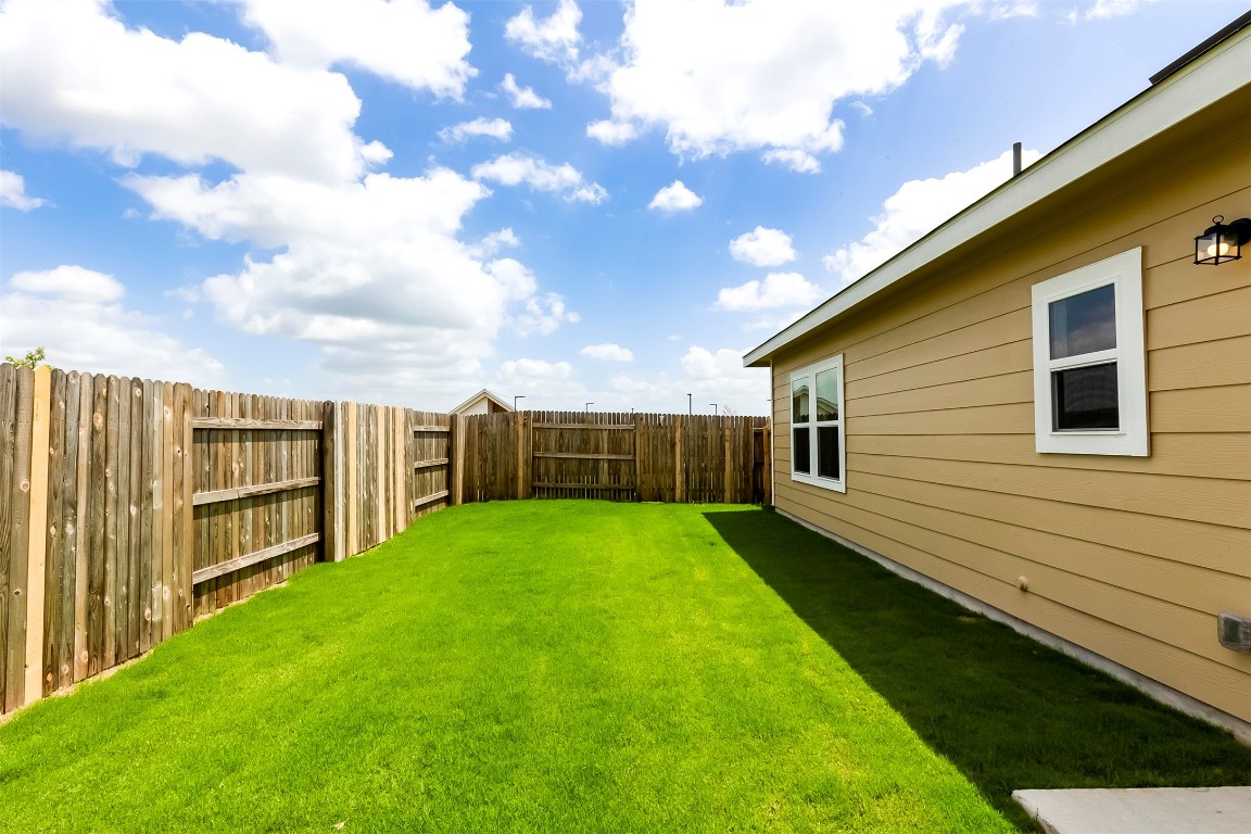 274 Jade Street Maxwell, TX 78656 - Photo 23 of 36 a view of a backyard with a small cabin