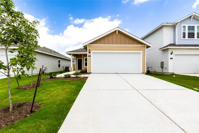 a view of a backyard with potted plants