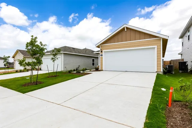 a view of a backyard with a small cabin