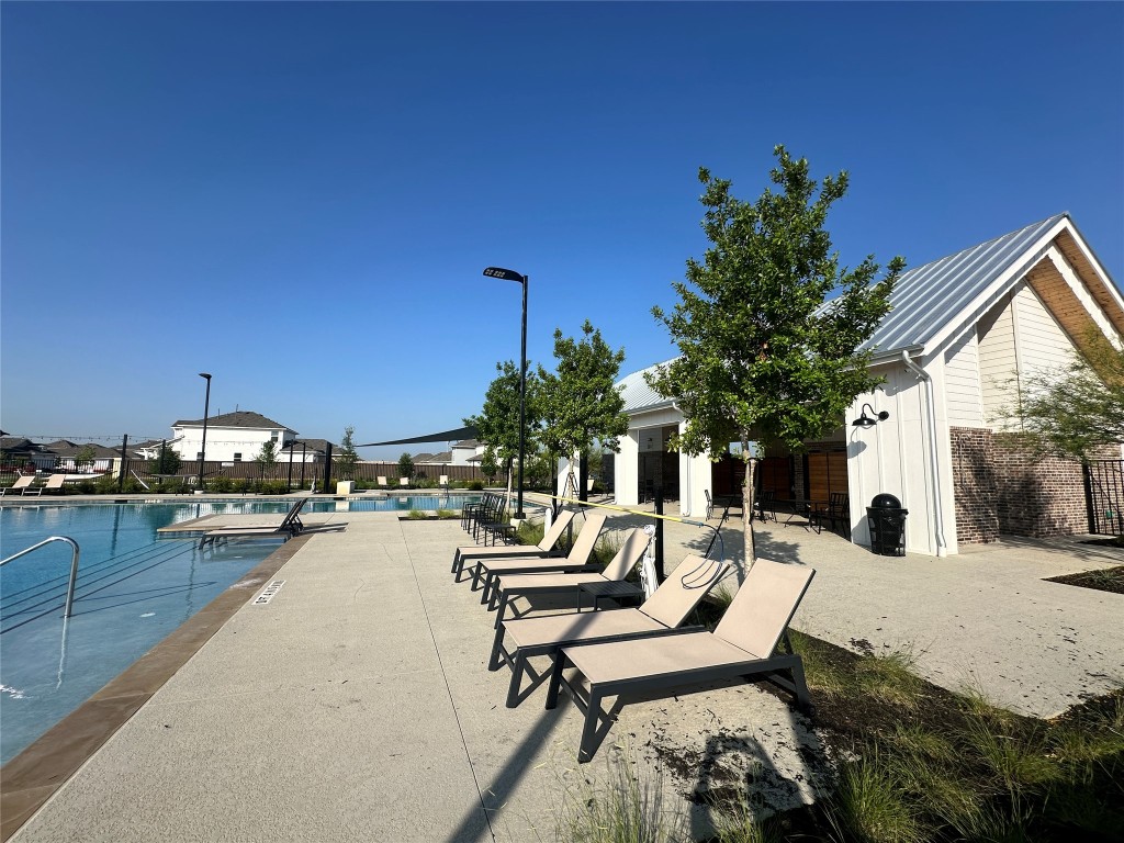 274 Jade Street Maxwell, TX 78656 - Photo 31 of 36 a swimming pool with outdoor seating and yard