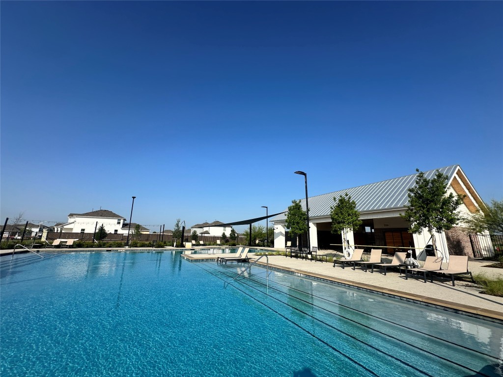 274 Jade Street Maxwell, TX 78656 - Photo 32 of 36 a view of a swimming pool and a chairs