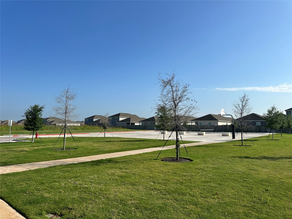 274 Jade Street Maxwell, TX 78656 - Photo 33 of 36 a view of a golf course with a lake