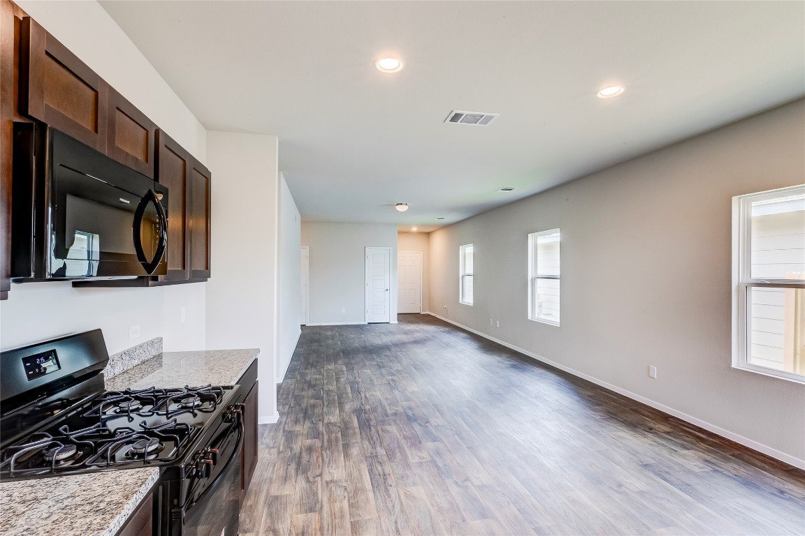274 Jade Street Maxwell, TX 78656 - Photo 36 of 36 a kitchen with a stove and a microwave
