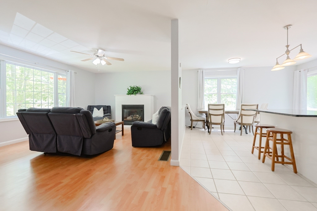 38 Tavern Road Groton, MA 01450 - Photo 9 of 25 a living room with furniture and a fireplace