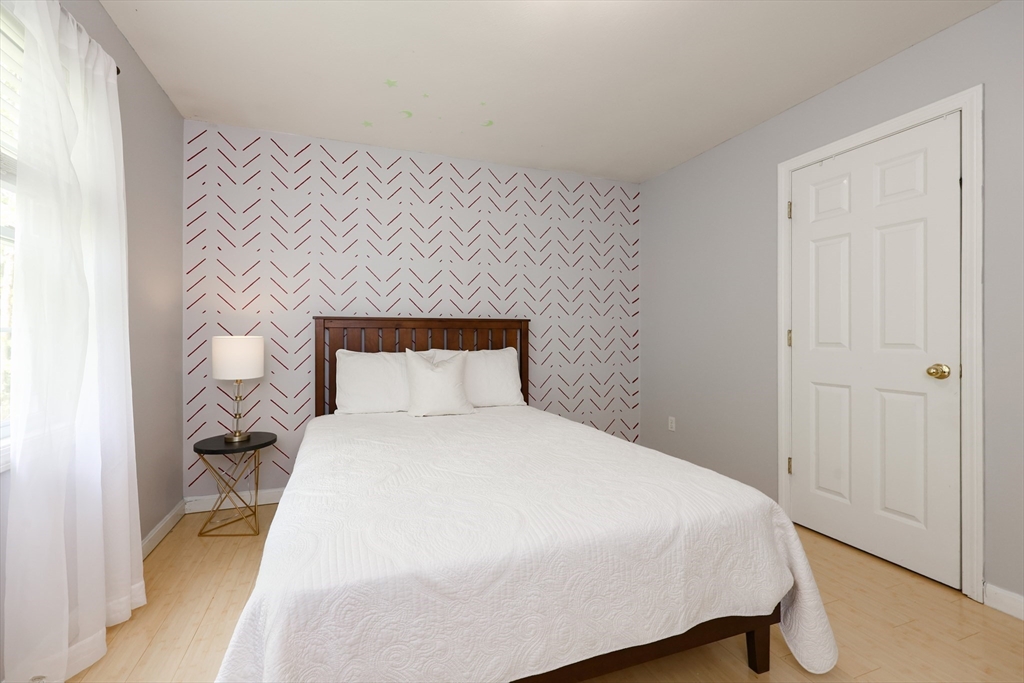 38 Tavern Road Groton, MA 01450 - Photo 10 of 25 a bedroom with a bed and a night stand