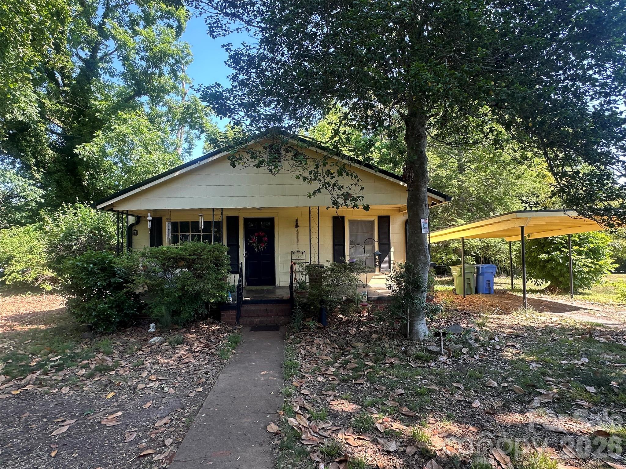 241 Wilson Road Rutherfordton, NC 28139 - Photo 1 of 14 a front view of a house with garden